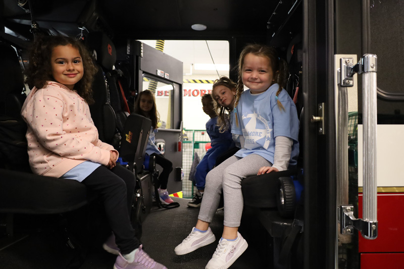 students in firehouse truck