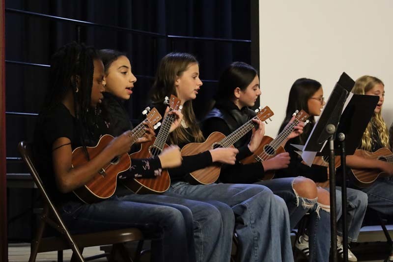 Members of the Ukelele Club gave a performance for trustees.