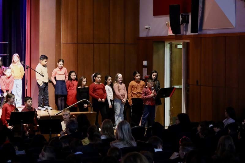 1) Fourth graders spread smiles from the stage at Winthrop Avenue School on Nov. 21 during their chorus concert.