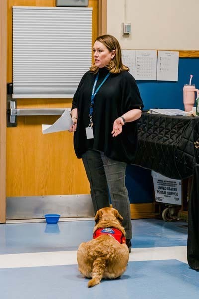 Worker with therapy dog.