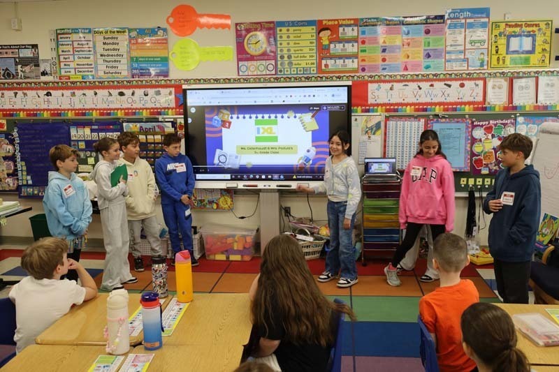 2)	With second graders, fifth graders taught a lesson on IXL, a digital learning platform. 