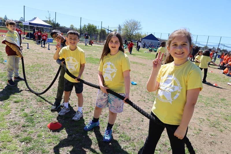 Students with equipment outside.