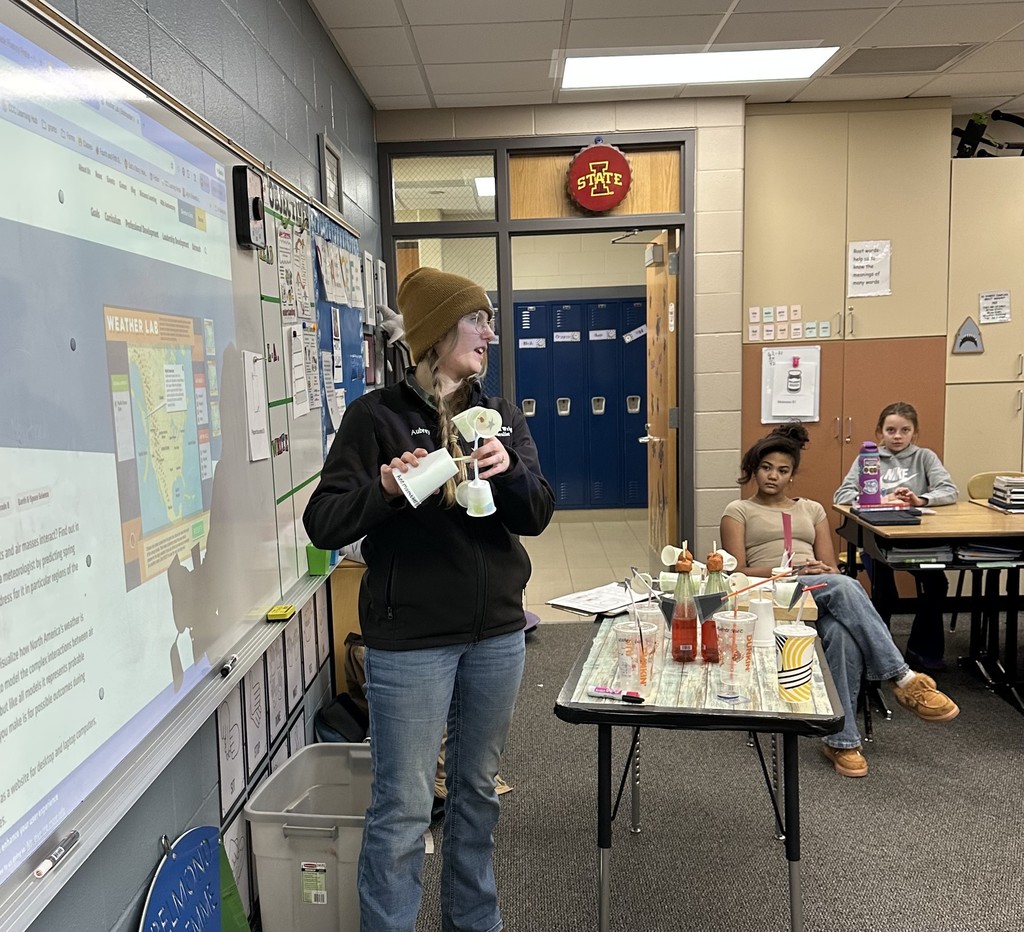 woman standing at whiteboard