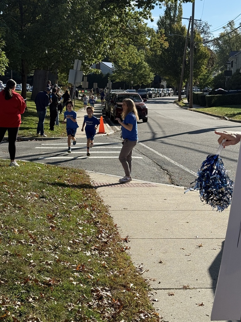 Principal cheering on the students