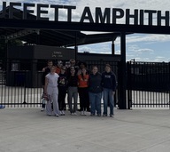 group photo in front of amphitheater