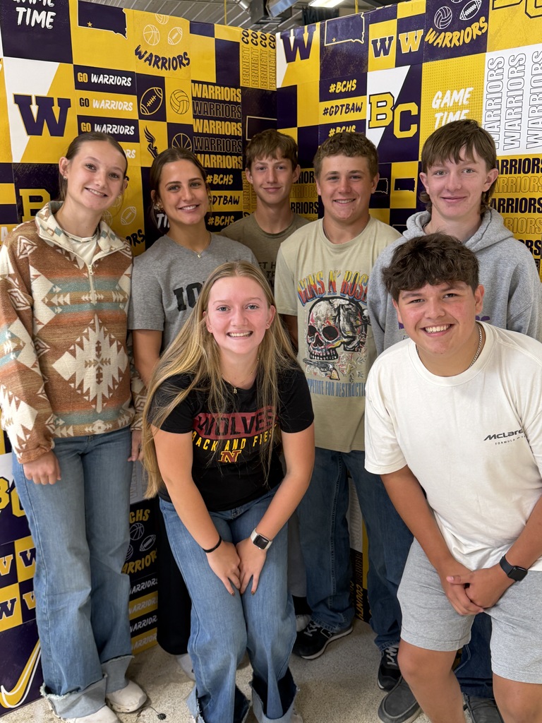 Ag students standing in front of their photo board.