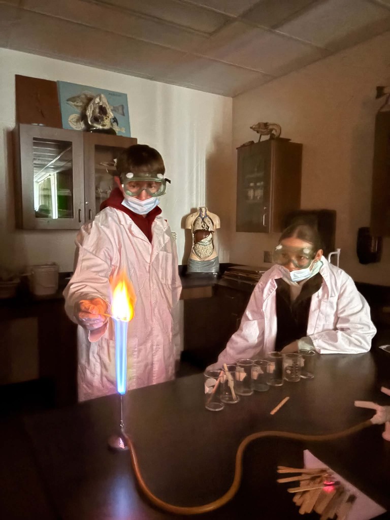 student making yellow flame