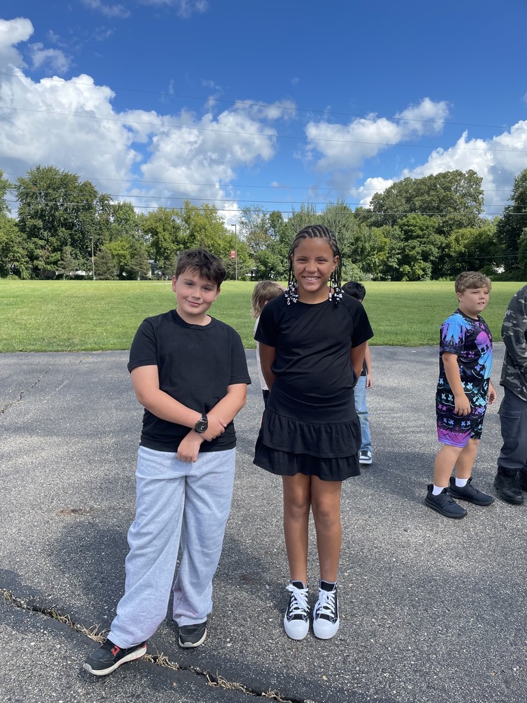Students posing on blacktop