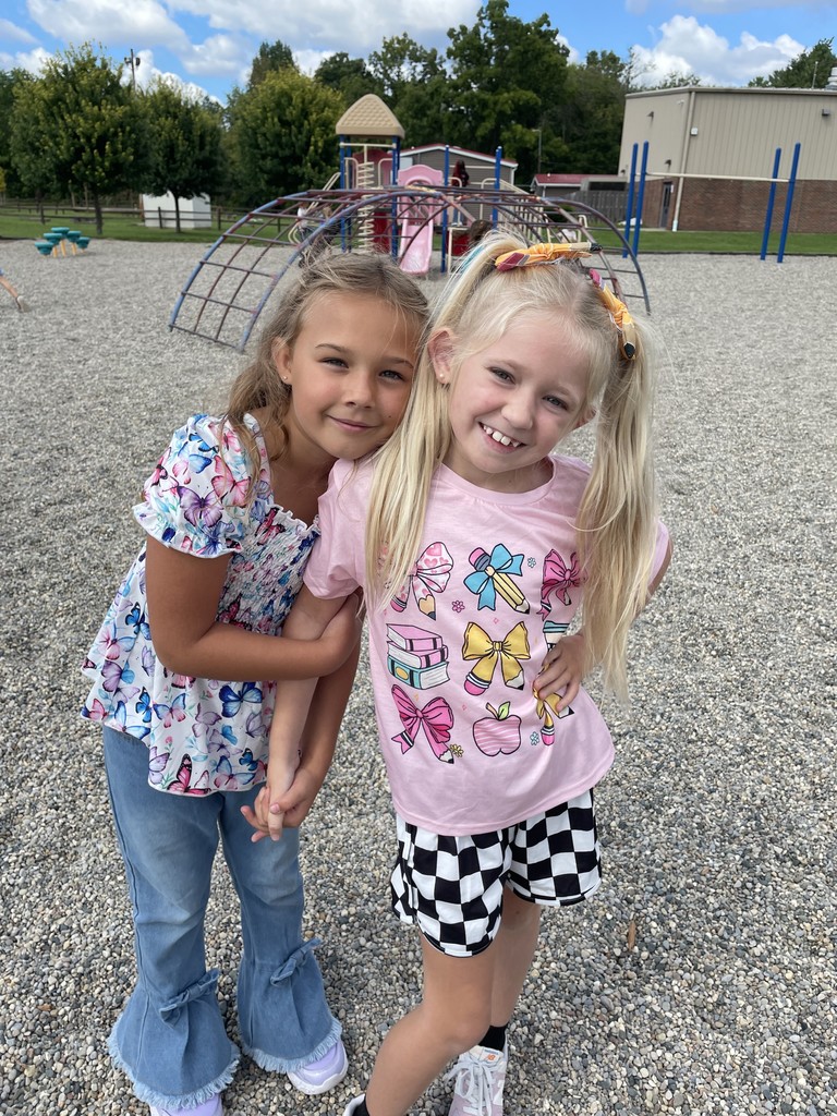 Two girls posing on playground