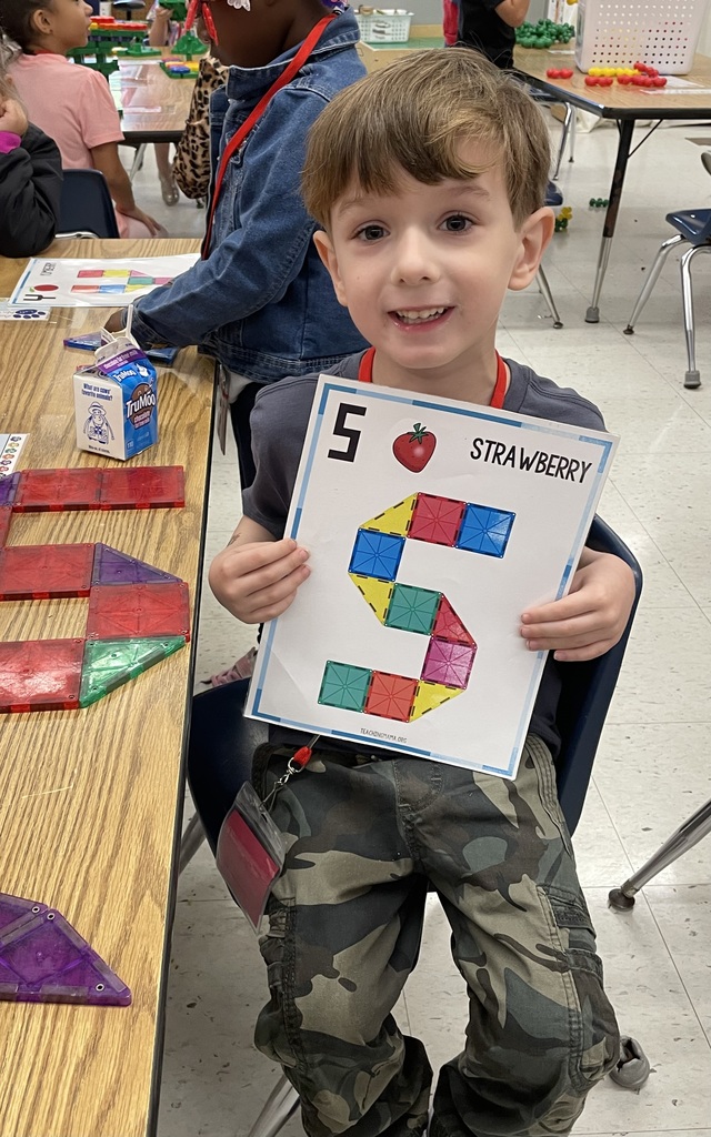Boy showing work