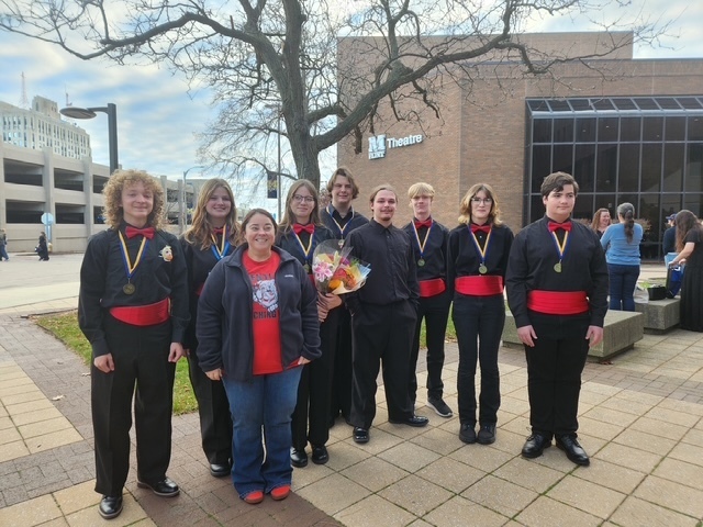 This image shows the Bentley students and their band director who participated in the UM Honors Band on 2025-11-23