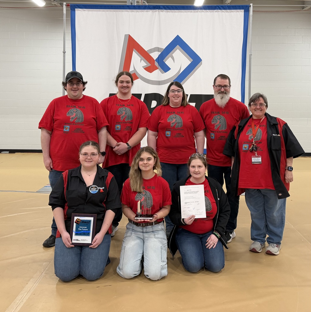 Bentley Robo-Raptors FRC robotics team holding their Judges Award.