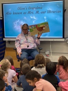 Grandmother reading to Kindergarten