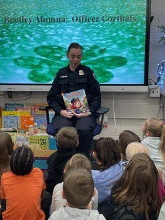 Officer reading to Kdg.