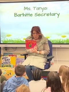 Secretary reading to Kindergarten