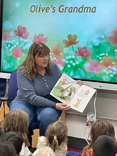 Grandmother reading to Kindergarten