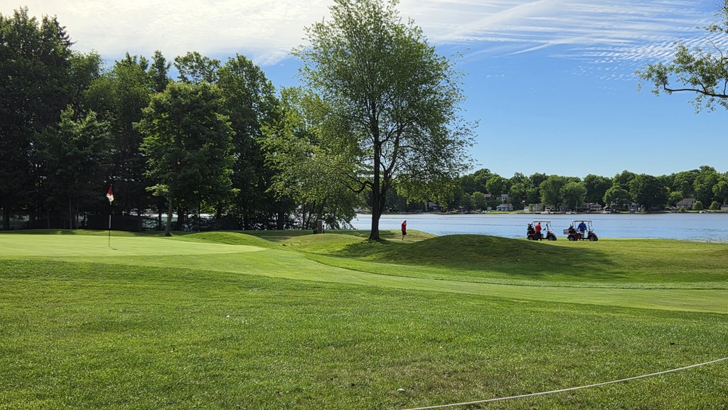 Image from the golf outing - looking across the green at a lake.