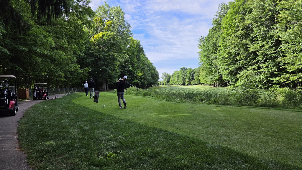 Image from the golf outing - a golfer hitting a ball