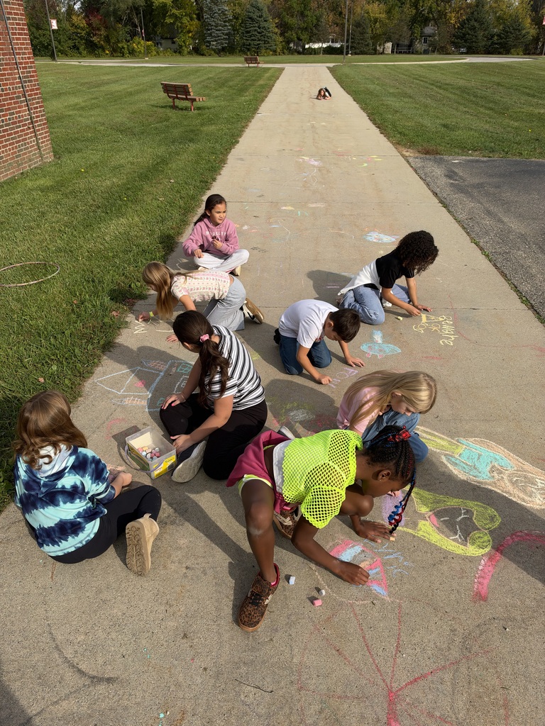 Children drawing on sidewalk