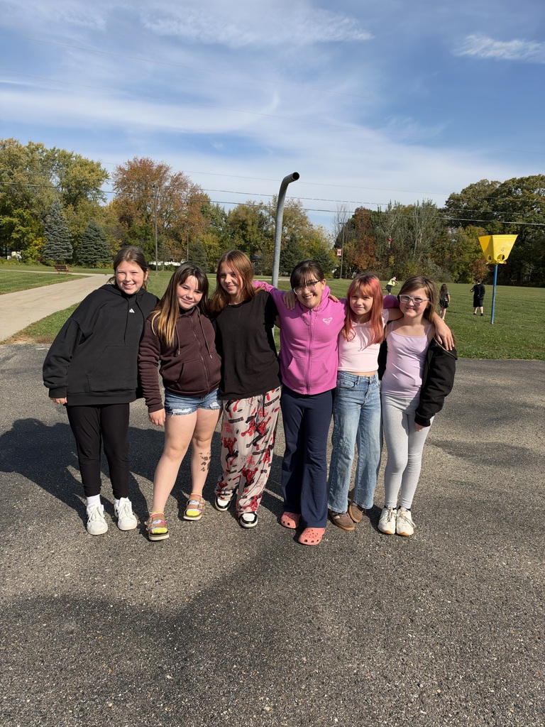 Girls posing for picture on the playground