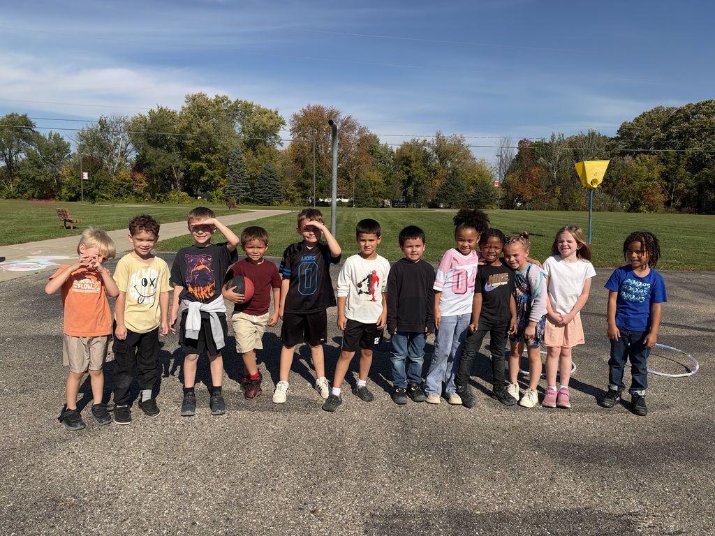 Children posing for a picture on the playground