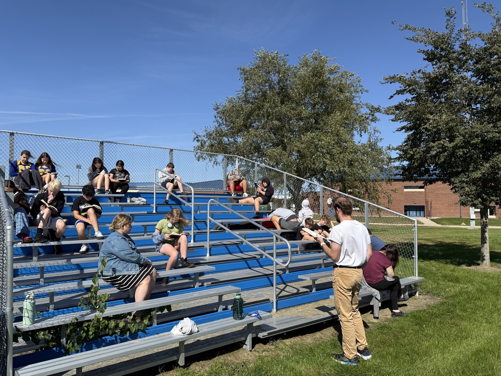 Students reading outdoors