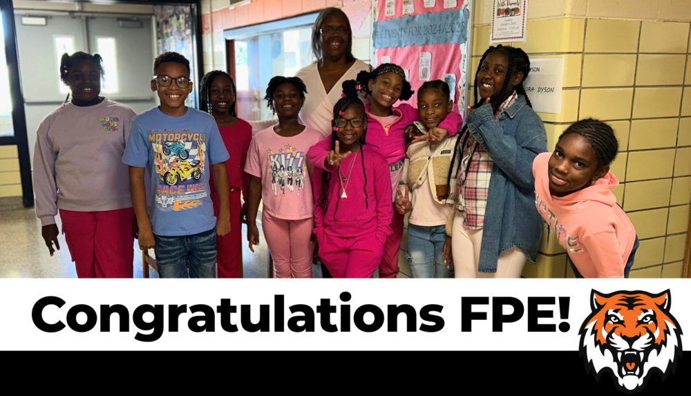 FPE Exits MDE Partnership Agreement. Group of students standing next to their teacher smiling and posing together