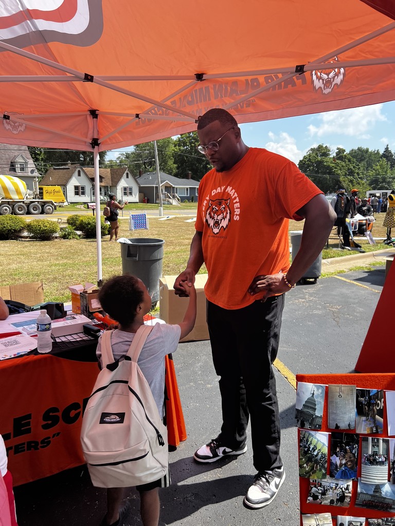 Fair Plain Middle School's Principal Alexander with a student at BHAS Back to School Bash.