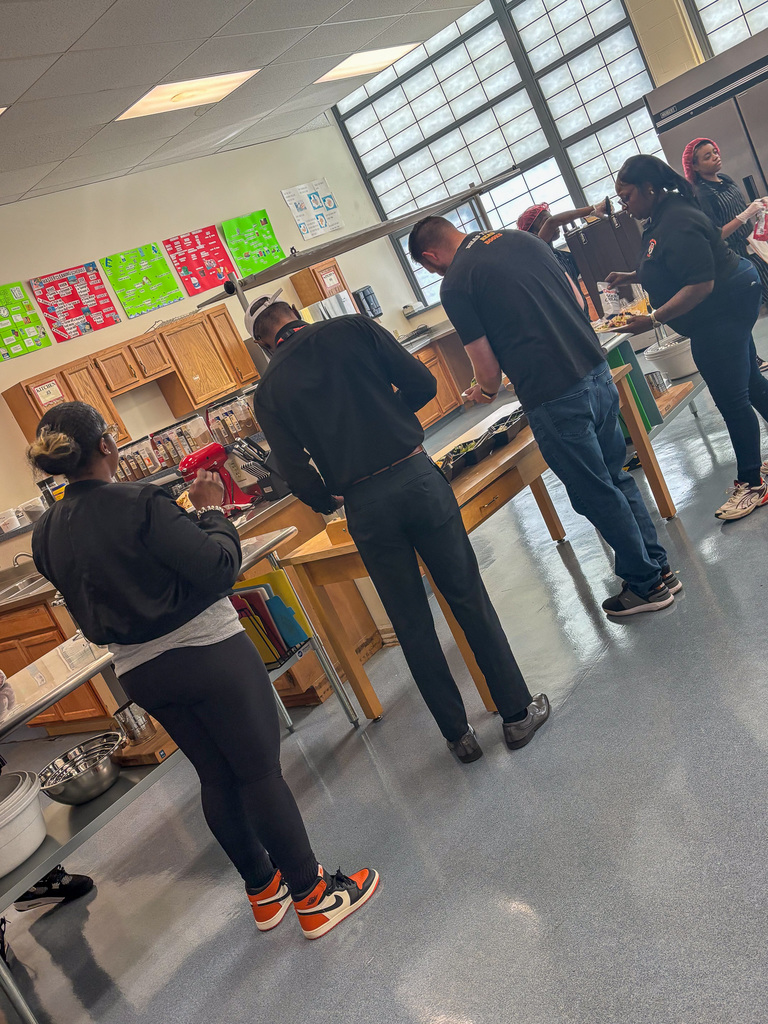 Staff getting lunch served by CTE Students