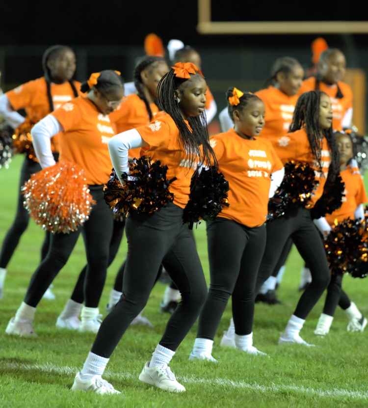 junior poms performing with Tiger Marching Band