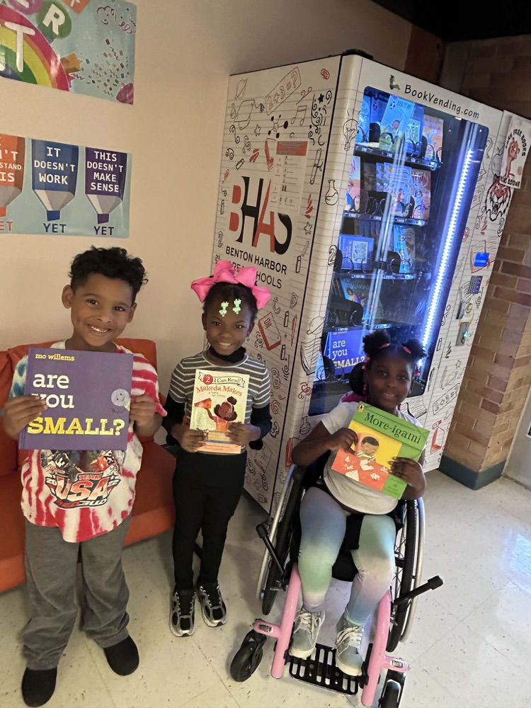 MLKJ students earning a free brand new book for excellent behavior.