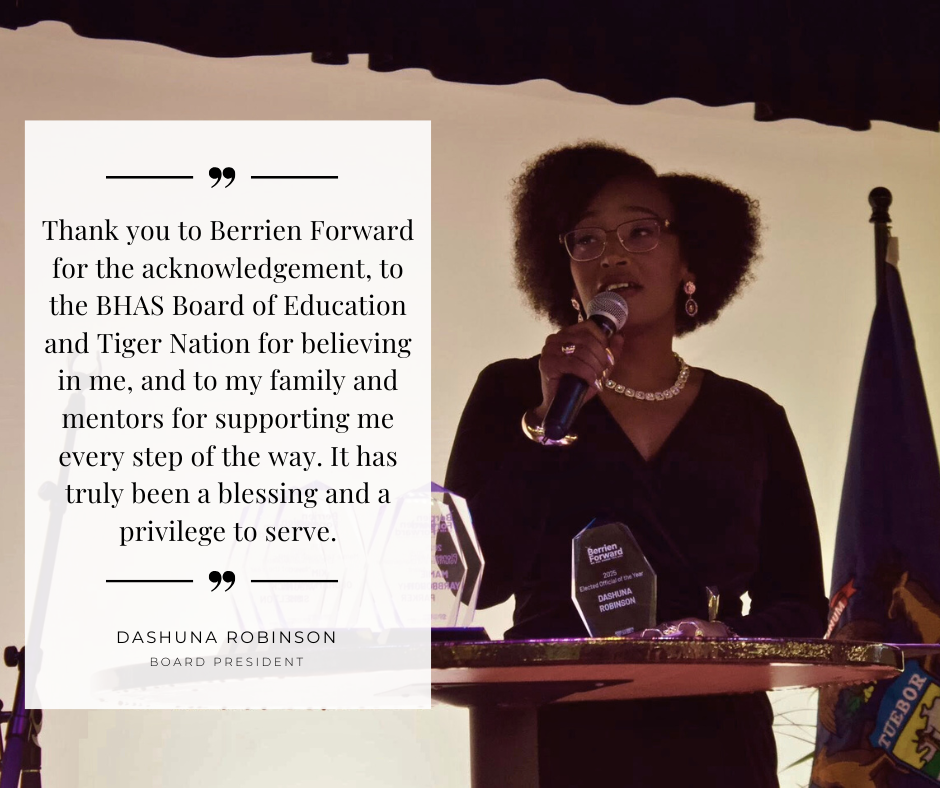 Dashuna Robinson stands at a podium speaking into a microphone while holding her Elected Official of the Year award. Beside her is a quote thanking Berrien Forward, the BHAS Board of Education, Tiger Nation, and her family and mentors, noting it has been a blessing and privilege to serve.