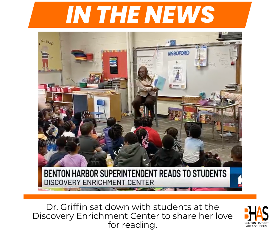 Dr. Griffin reads a book to a group of young students sitting on the floor in a classroom. The text on the graphic reads: in the news.