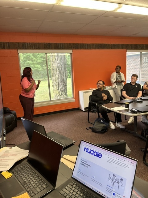 Presenter addressing new BHAS educators during a New Teacher Orientation session.