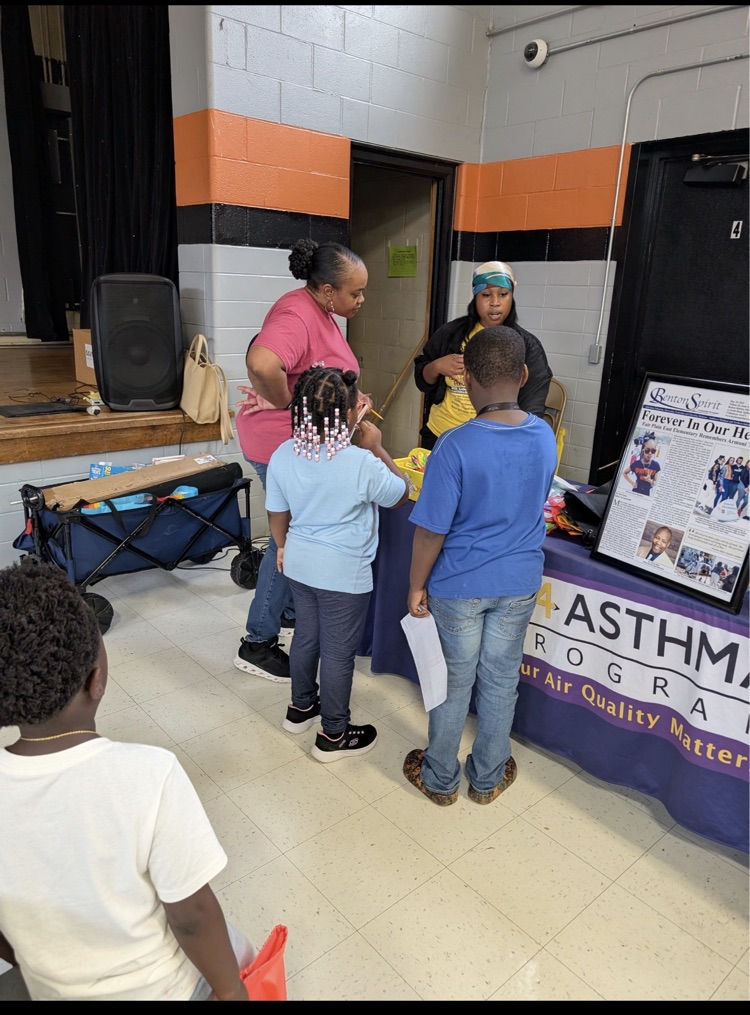 families actively participating at fair plain east academic game night.