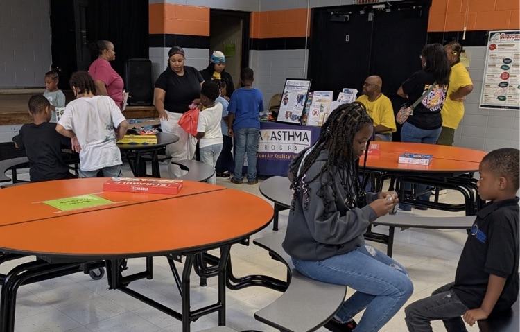 families actively participating at fair plain east academic game night