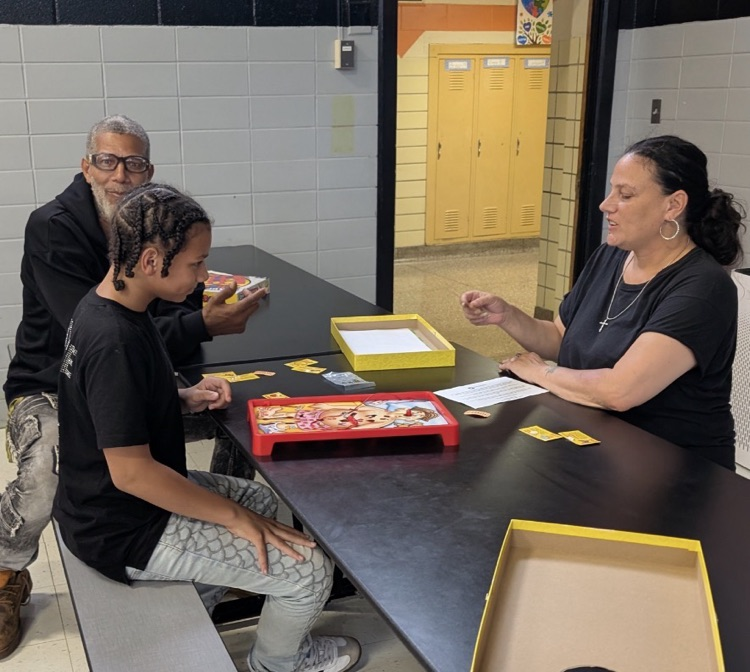 families actively participating at fair plain east academic game night