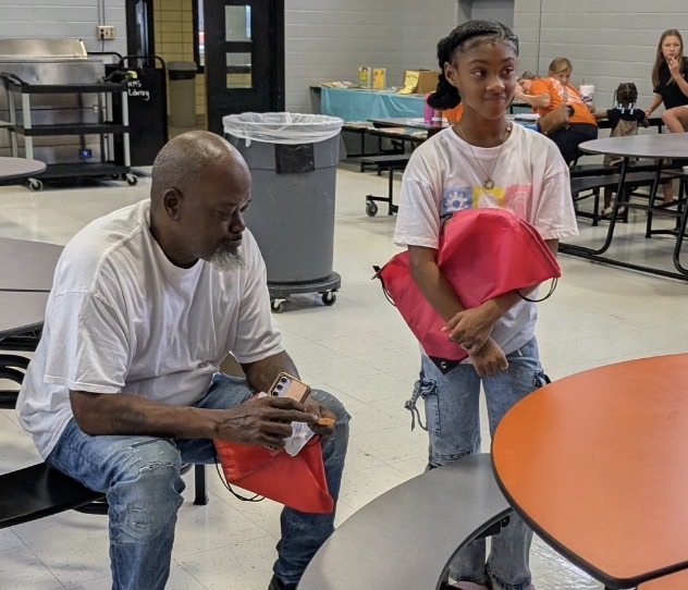 families actively participating at fair plain east academic game night