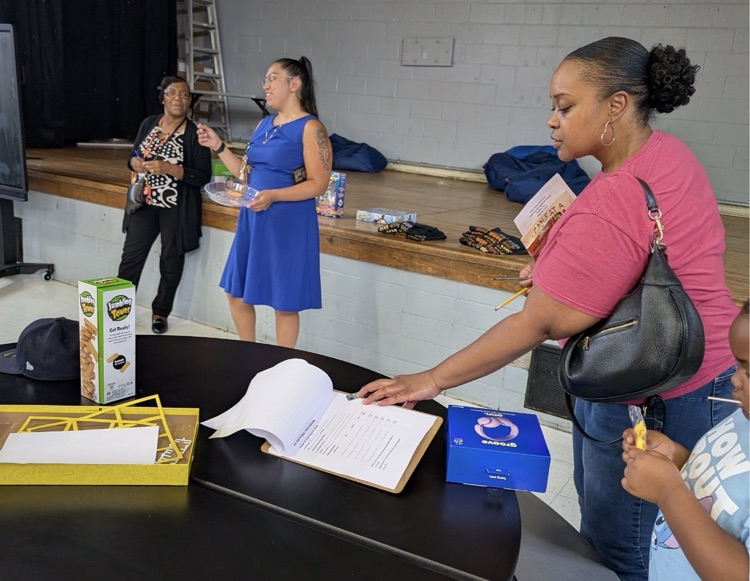 families actively participating at fair plain east academic game night