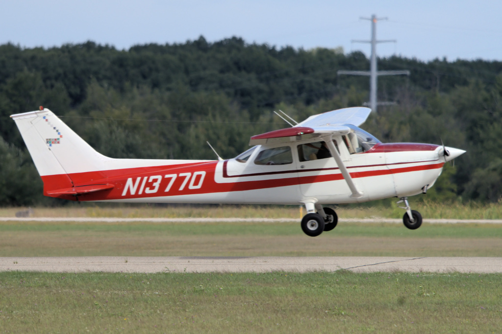 Training aircraft approaching the runway for landing during a student aviation flight.