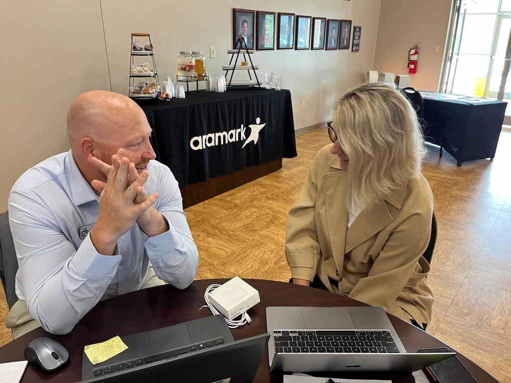 Chris Johnson and Debra Caldwell collaborating at a desk