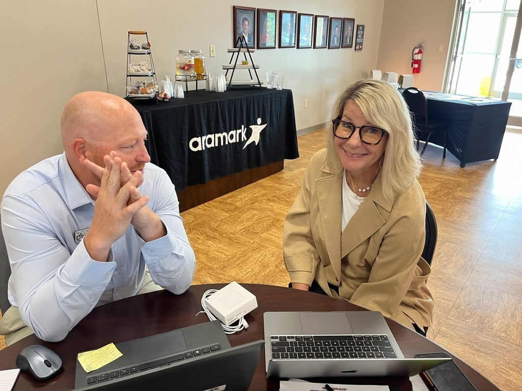 Chris Johnson and Debra Caldwell collaborating at a desk