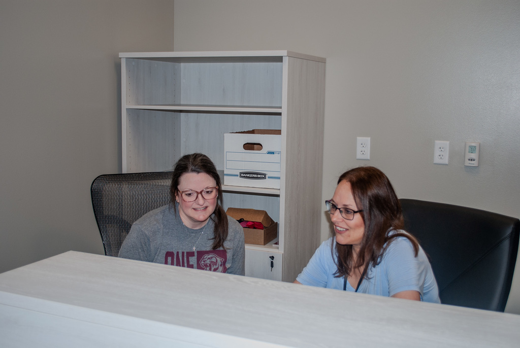 Mrs. Musser and Mrs. Cleghorn working on student enrollment