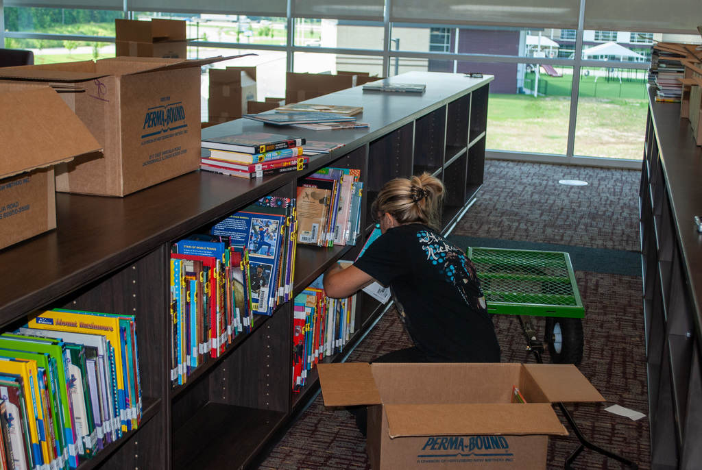 Helpers shelving books