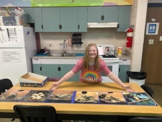 Ellie with the giant puzzle that she completed!