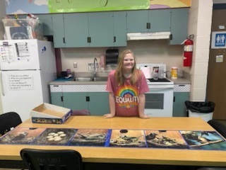 Ellie with the giant puzzle that she completed!