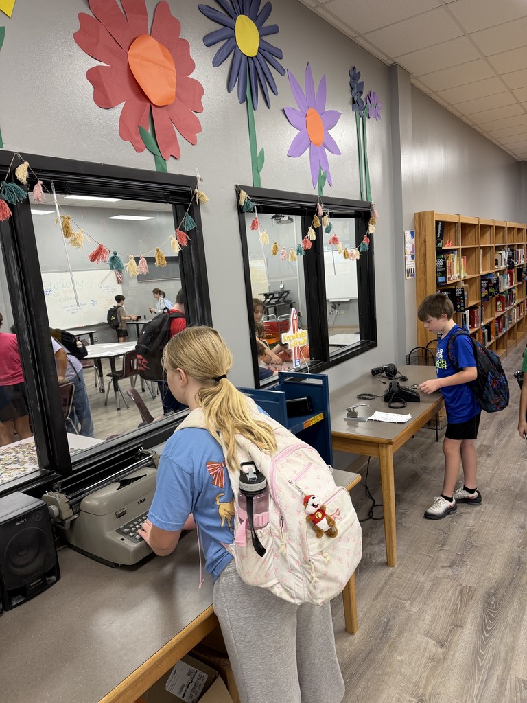 Two students exploring old technology
