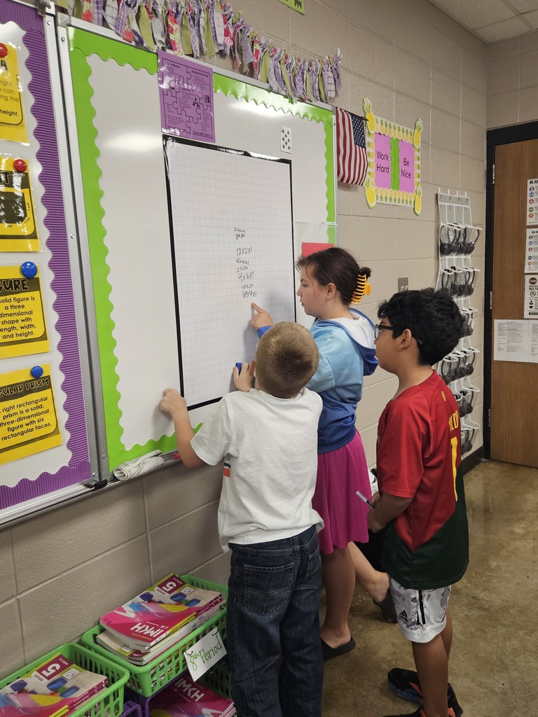 Students at the board working together