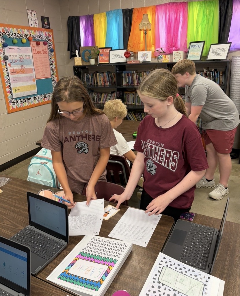 Students working together to critique each others writing