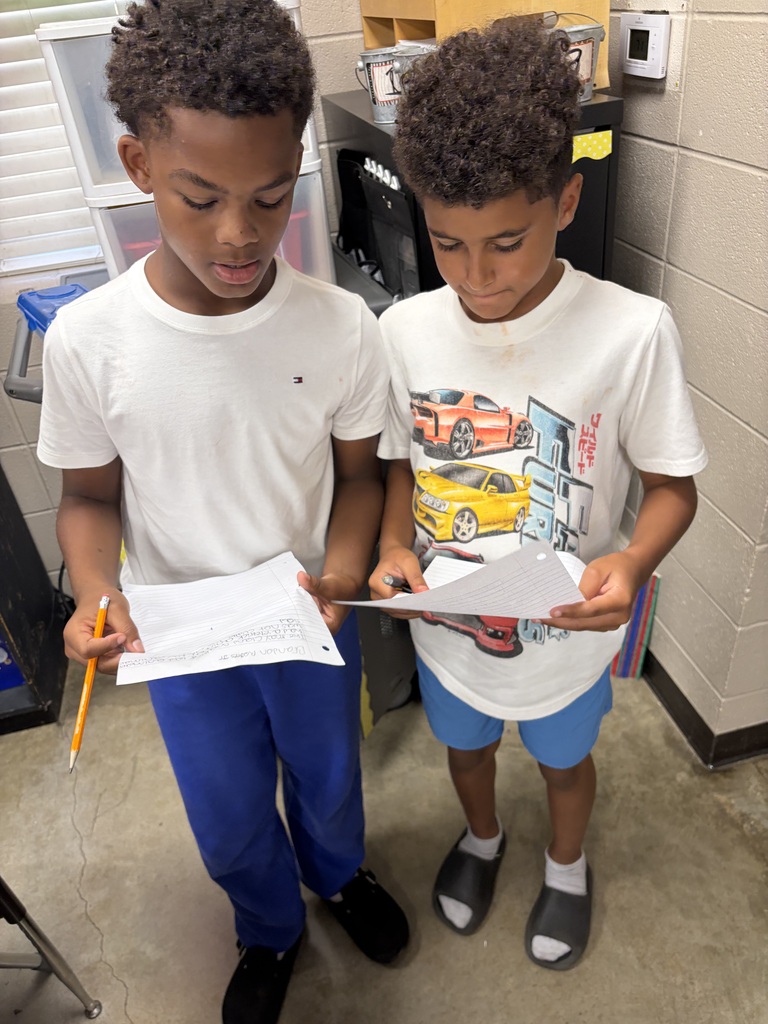 Students working together to critique each others writing